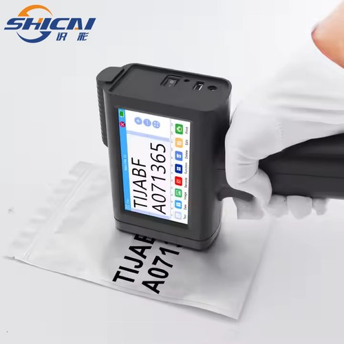 Handheld inkjet printer prints