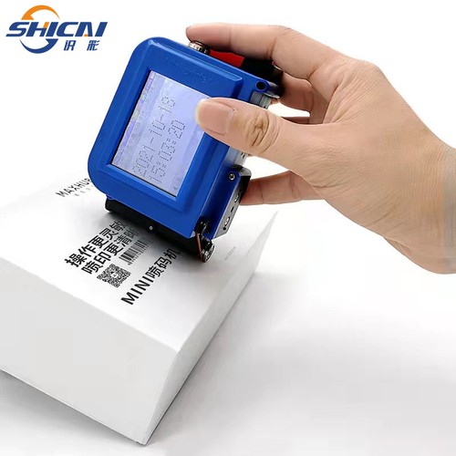 Handheld inkjet printer prints